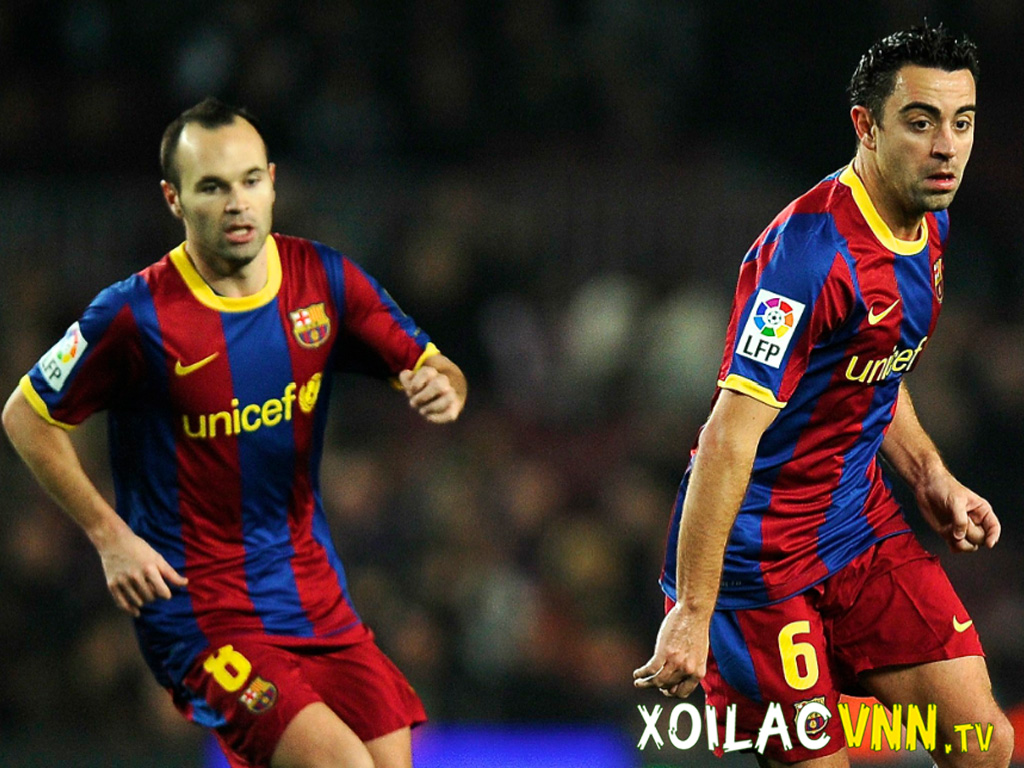 xavi-va-iniesta-la-cap-tien-ve-hang-dau
